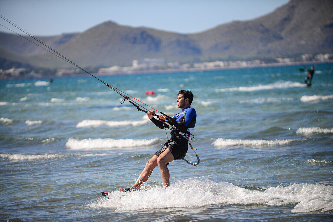 Kitesurfing in Port de Pollenca beach, Mallorca, Spain