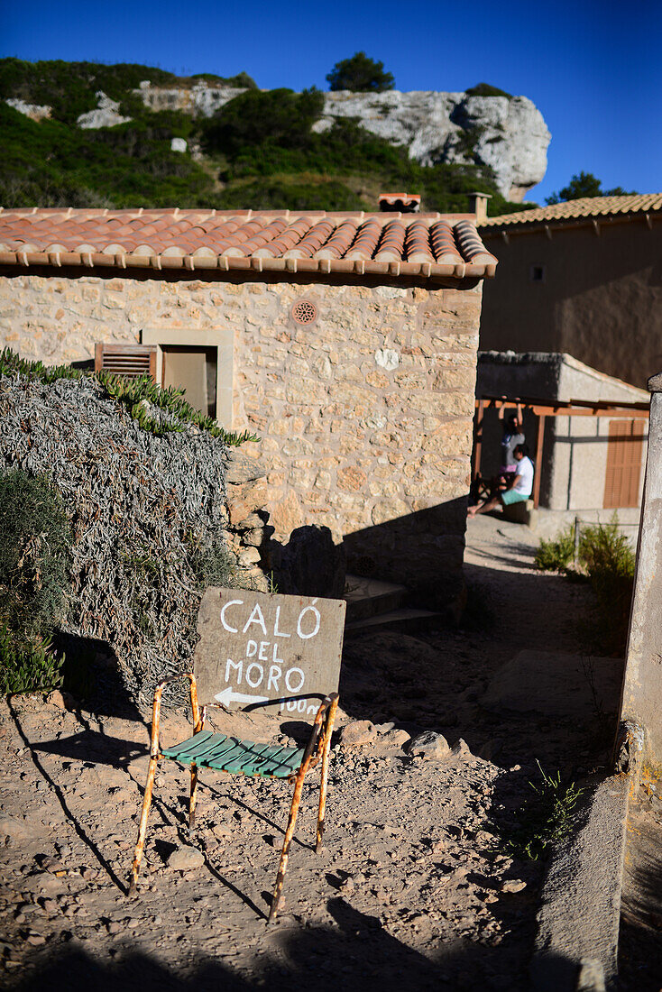 Handmade sign indicates Calo des Moro beach in Mallorca, Spain