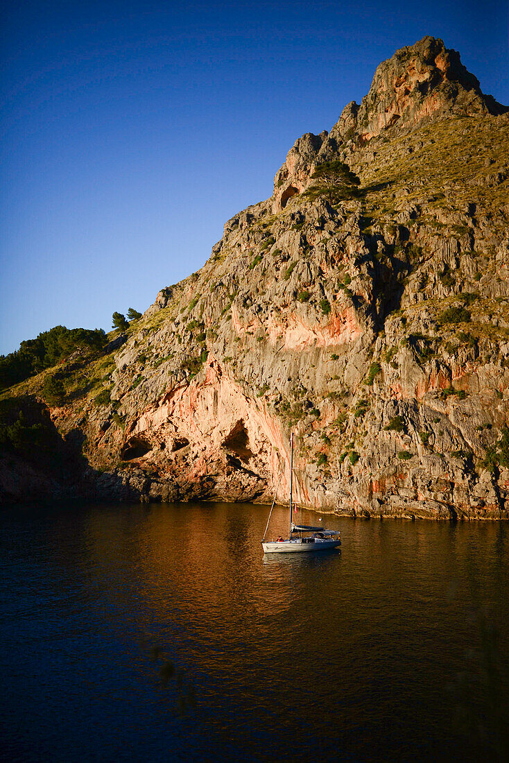 Sailing boat at sunset in Torrent de Pareis, Mallorca, Spain