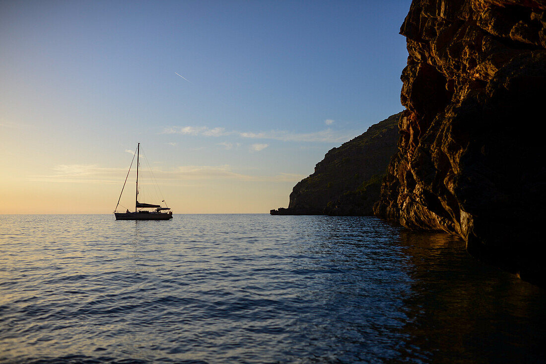 Sailing boat at sunset in Torrent de Pareis, Mallorca, Spain