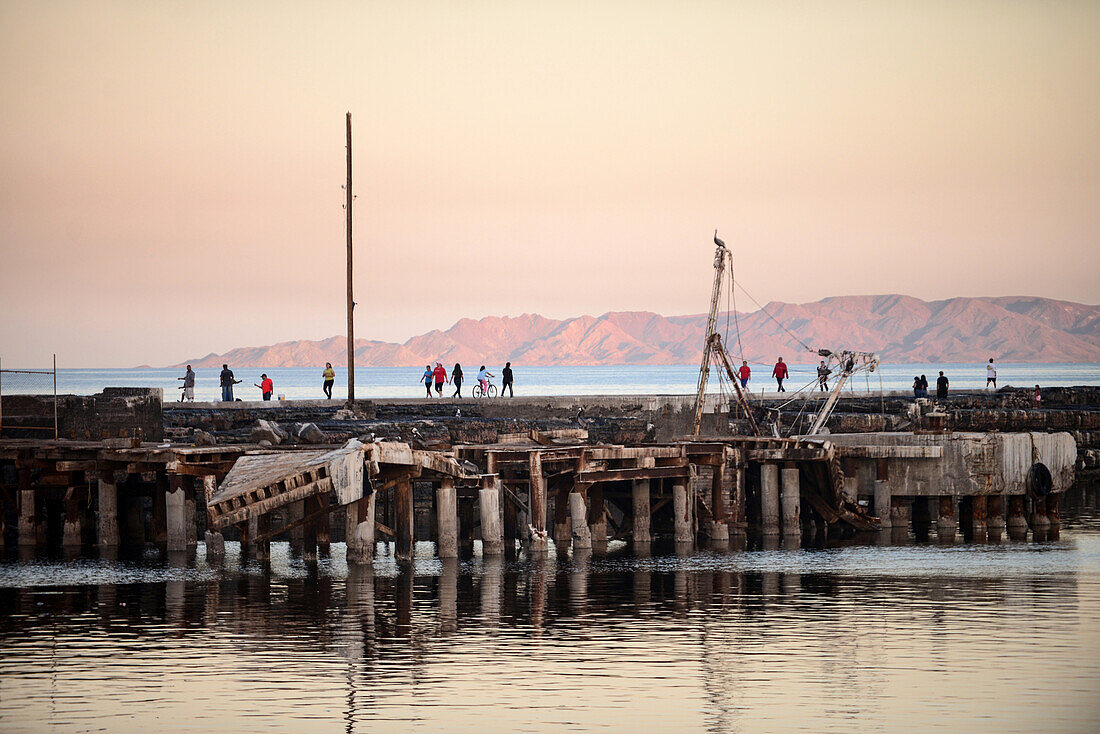 People walking on Santa Rosalia port dock, Baja California Sur, Mexico