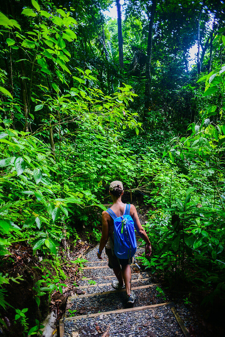 Young caucasian adventurous woman exploring Manuel Antonio National Park in Costa Rica