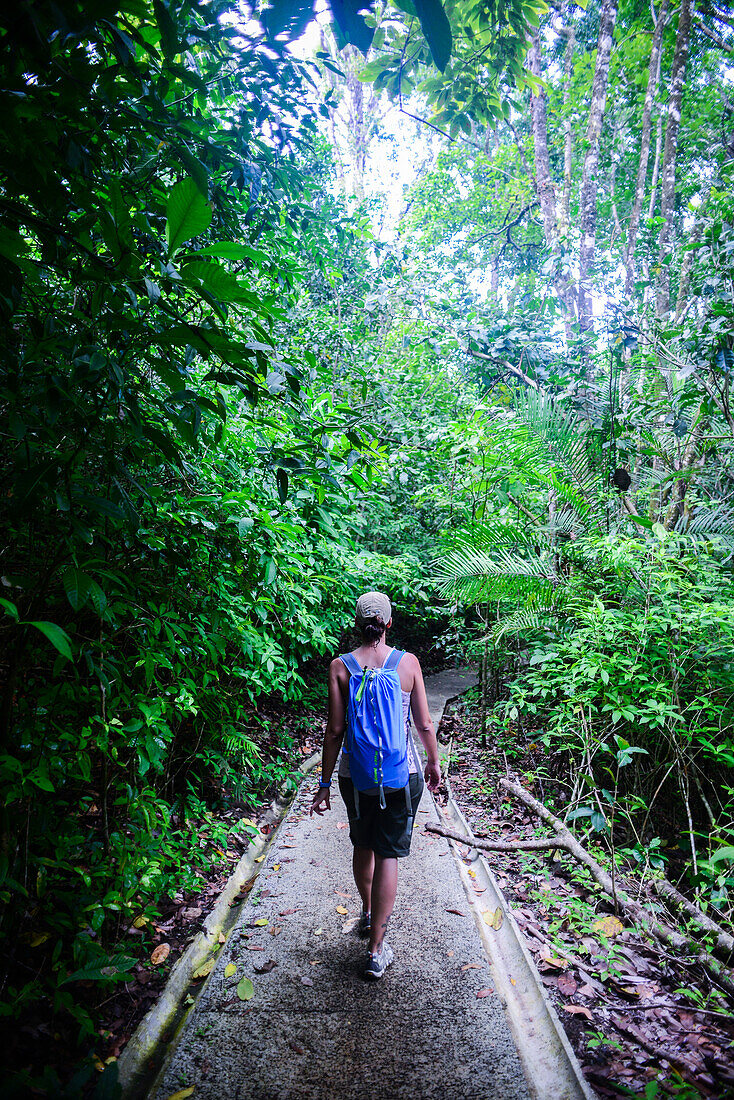 Young caucasian adventurous woman exploring Manuel Antonio National Park in Costa Rica