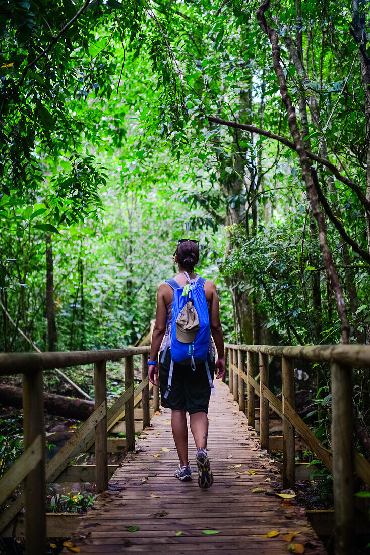 Young caucasian adventurous woman exploring Manuel Antonio National Park in Costa Rica