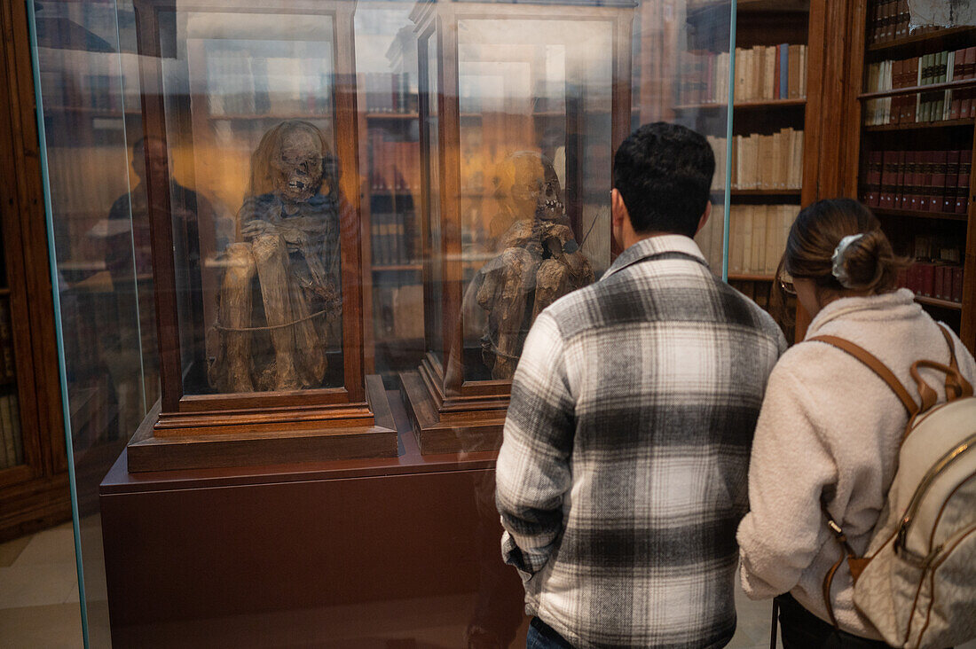 Visitors surprised with mummy of a girl and a boy at The Carmo Archaeological Museum (MAC), located in Carmo Convent, Lisbon, Portugal