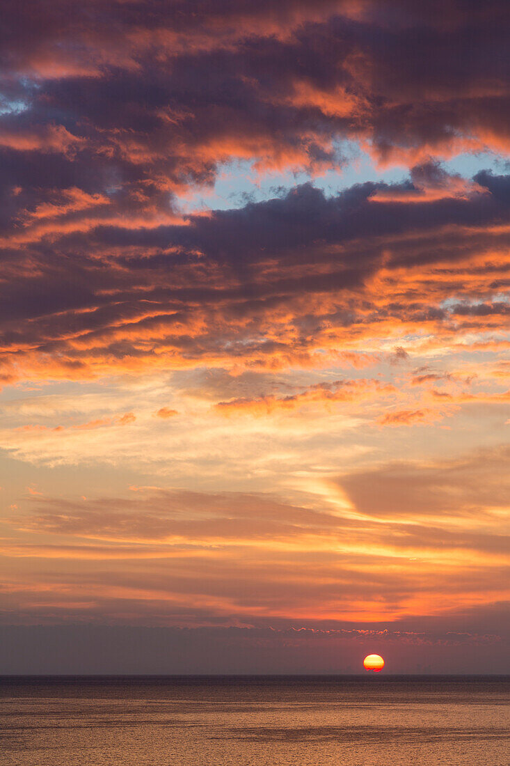 Partly cloudy sunrise near Cala San Felice Bay in Vieste, Gargano, Foggia district, Apulia, Italy