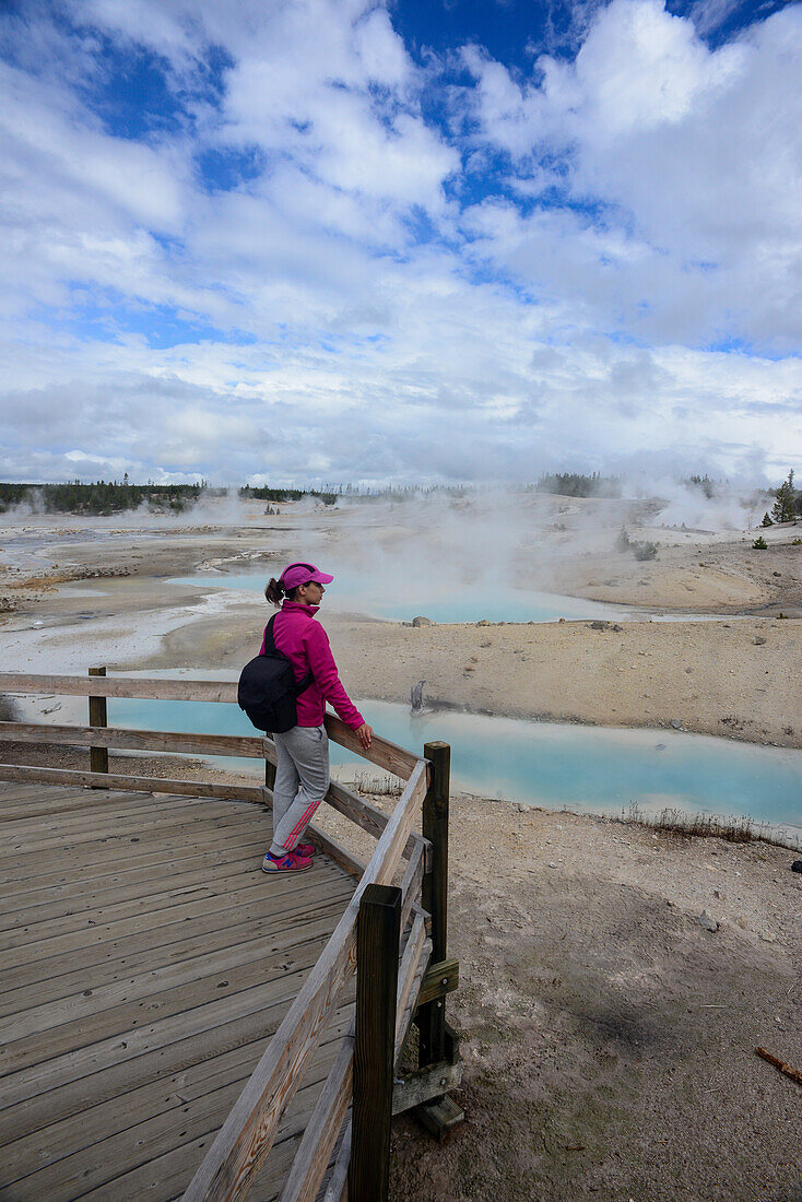 Young woman in Norris Geyser Basin, Yellowstone National Park, USA