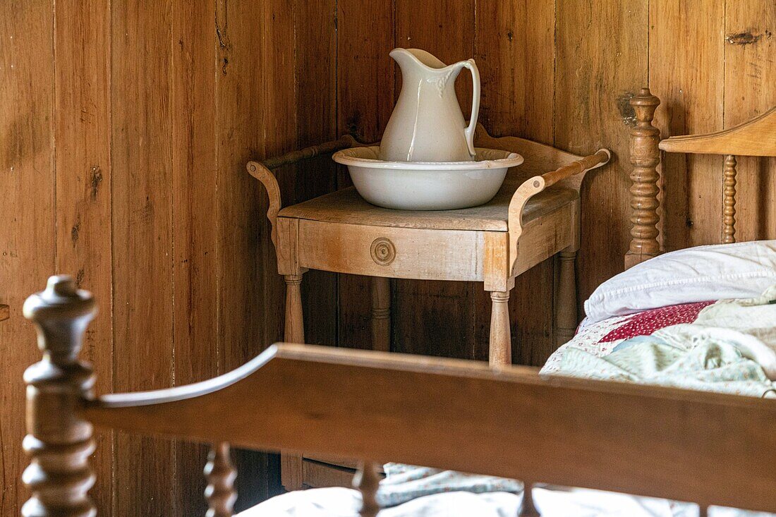 Bedroom in the godin house built in 1890, historic acadian village, bertrand, new brunswick, canada, north america