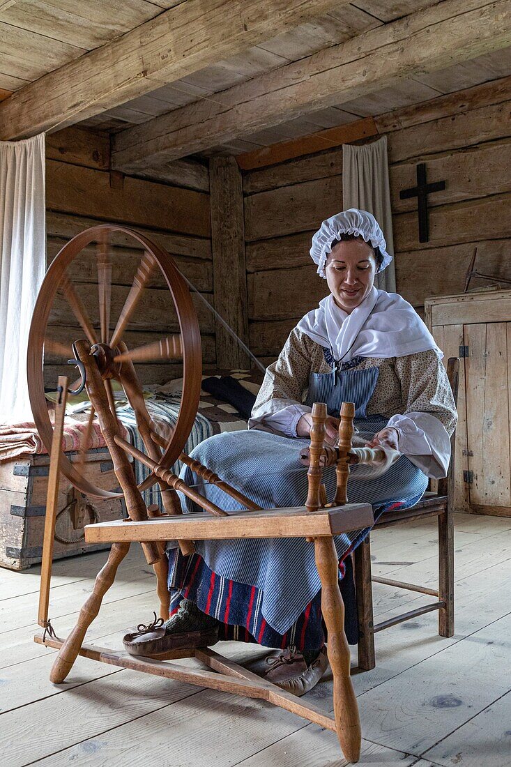 Sheep's wool weaver, robichaud farm, historic acadian village, bertrand, new brunswick, canada, north america