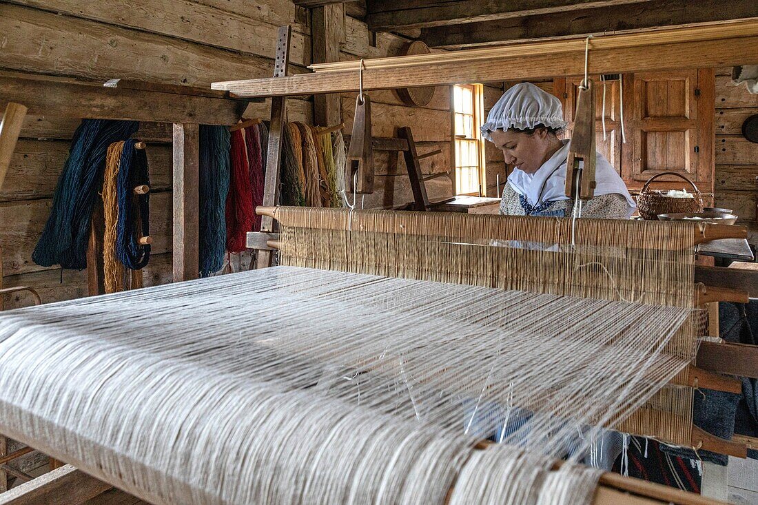 Sheep's wool weaver, robichaud farm, historic acadian village, bertrand, new brunswick, canada, north america