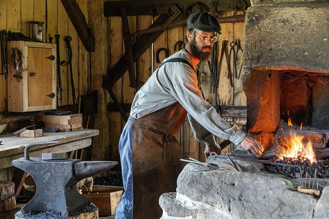 The blacksmith and the forge from 1874, historic acadian village, bertrand, new brunswick, canada, north america