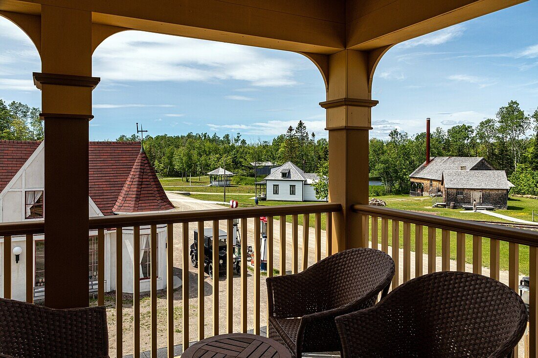 Terrace of the chateau albert hotel built in  1907, historic acadian village, bertrand, new brunswick, canada, north america