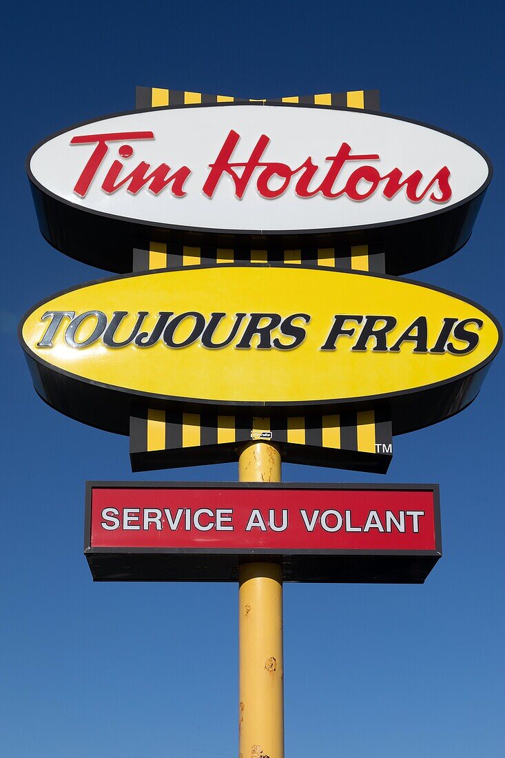 Sign for the fast food chain tim hortons, drive-in and fresh produce, caraquet, new brunswick, canada, north america