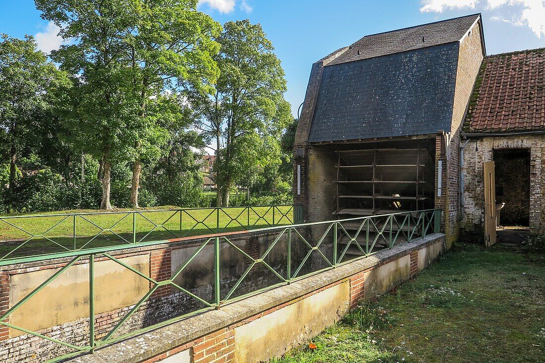 Waterwheel in front of the fenderie (former industrial site), rugles, eure, normandy, france