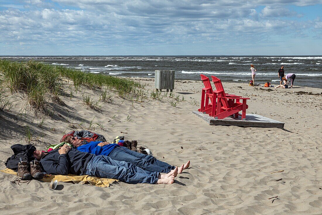 Red beach chair on the beach of saint louis lagoon, kouchibouguac national park, new brunswick, canada, north america