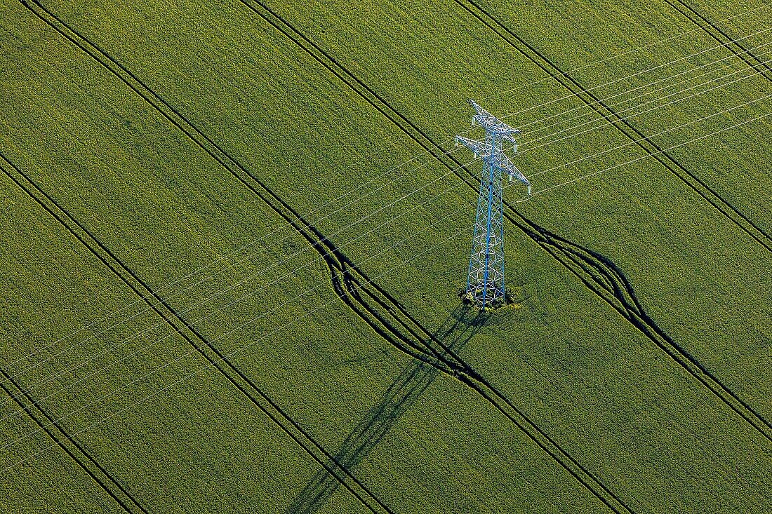 Pylon for high-voltage power lines in the middle of the fields of grain, eure, normandy, france