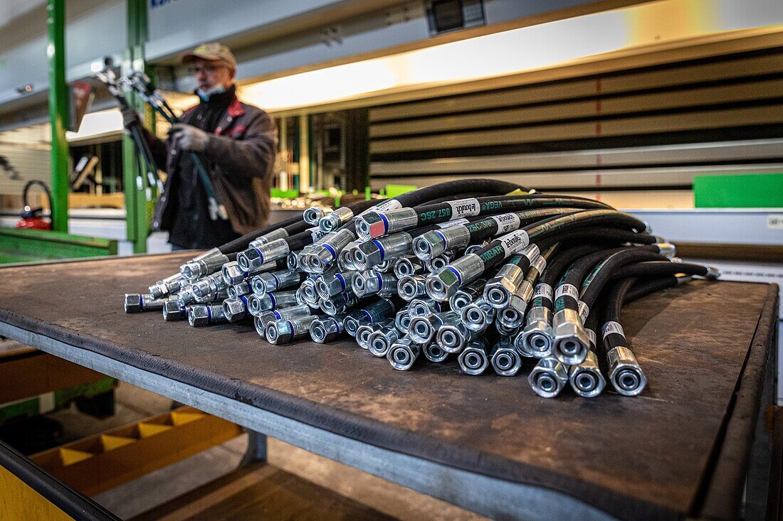 Brake hoses in front of the kardex for the storage of parts used in the manufacturing of trailers and farm equipment, jlb lebouch company, la vieille-lyre, eure, normandy, france