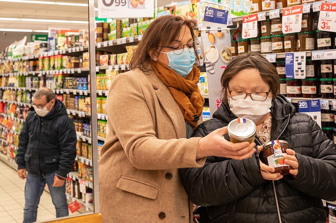 Shopping at the super market, slightly handicapped people working on their autonomy, care home for adults with mental disabilities, residence la charentonne, adapei27, association departementale d'amis et de parents, bernay, eure, normandy, france