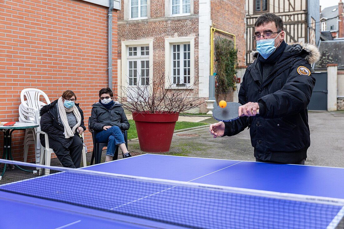 A game of ping-pong, care home for adults with mental disabilities, residence la charentonne, adapei27, association departementale d'amis et de parents, bernay, eure, normandy, france