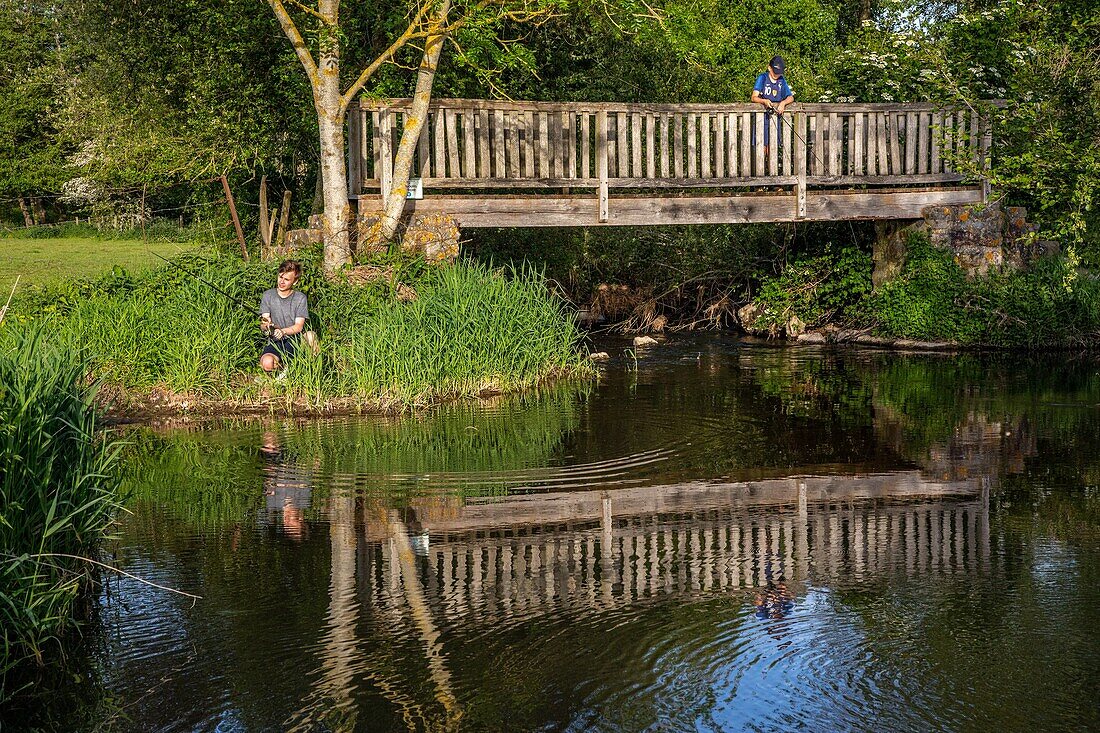 Young fishers on the iton river, cintray, iton river valley, eure, normandy, france