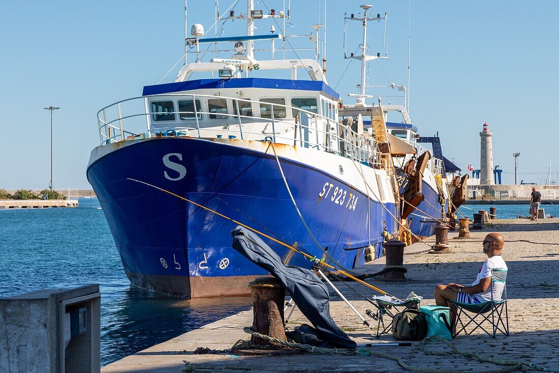 Fisherman on the port, sete, herault, occitanie, france