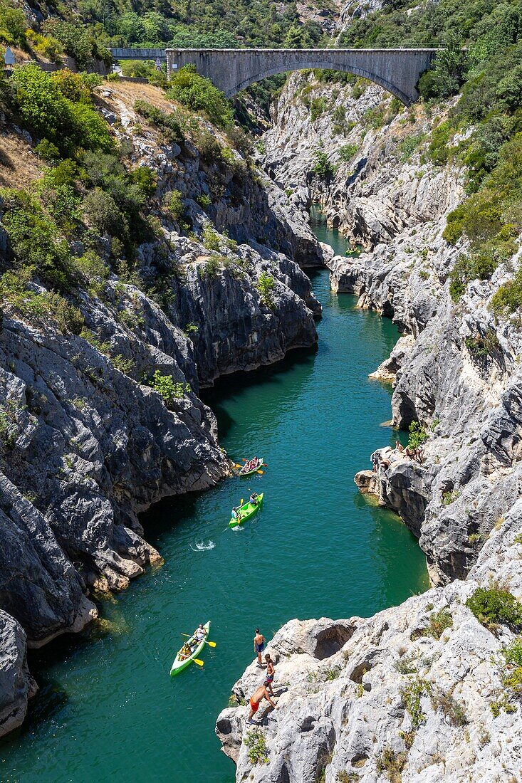 Canoes and bathers, gorges of the herault along the way of saint james, aniane, saint-guilhem-le-desert, herault, occitanie, france