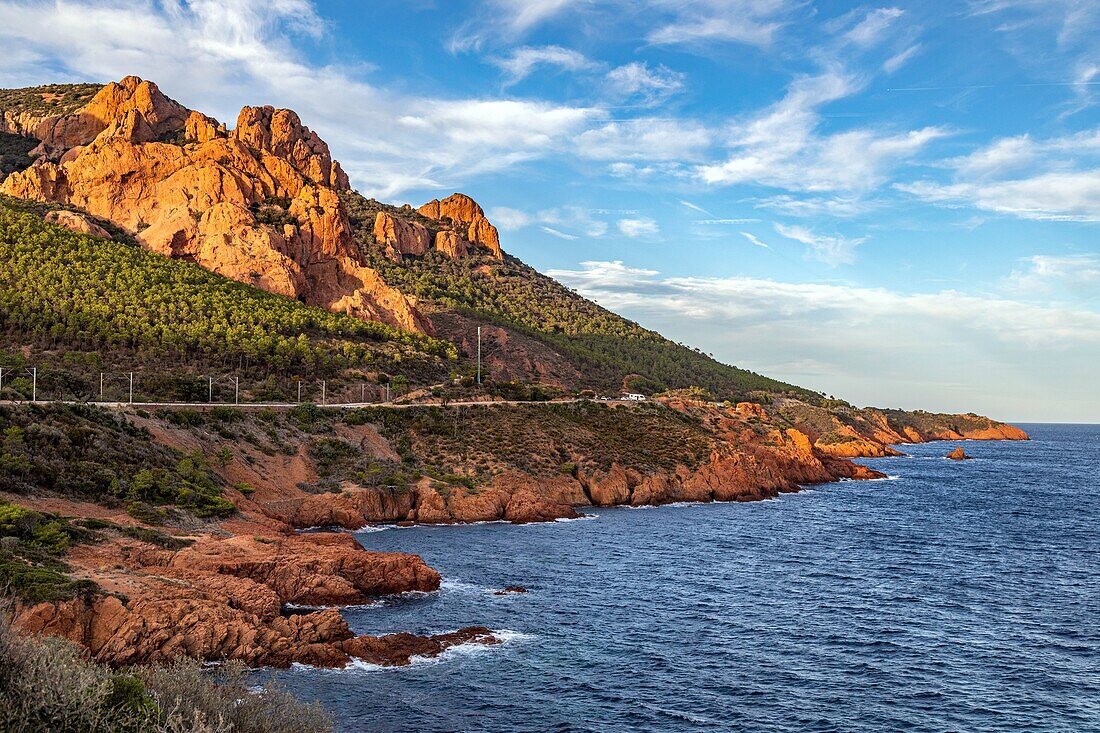 Calanque du petit caneiret inlet in front of the red rocks of the massif de l'esterel, saint-raphael, var, france