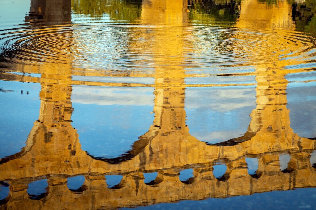 The three-leveled pont du gard, old roman aqueduct that crosses the gardon river and dates from the first century bc, listed as a historic monument, vers-pont-du-gard, france