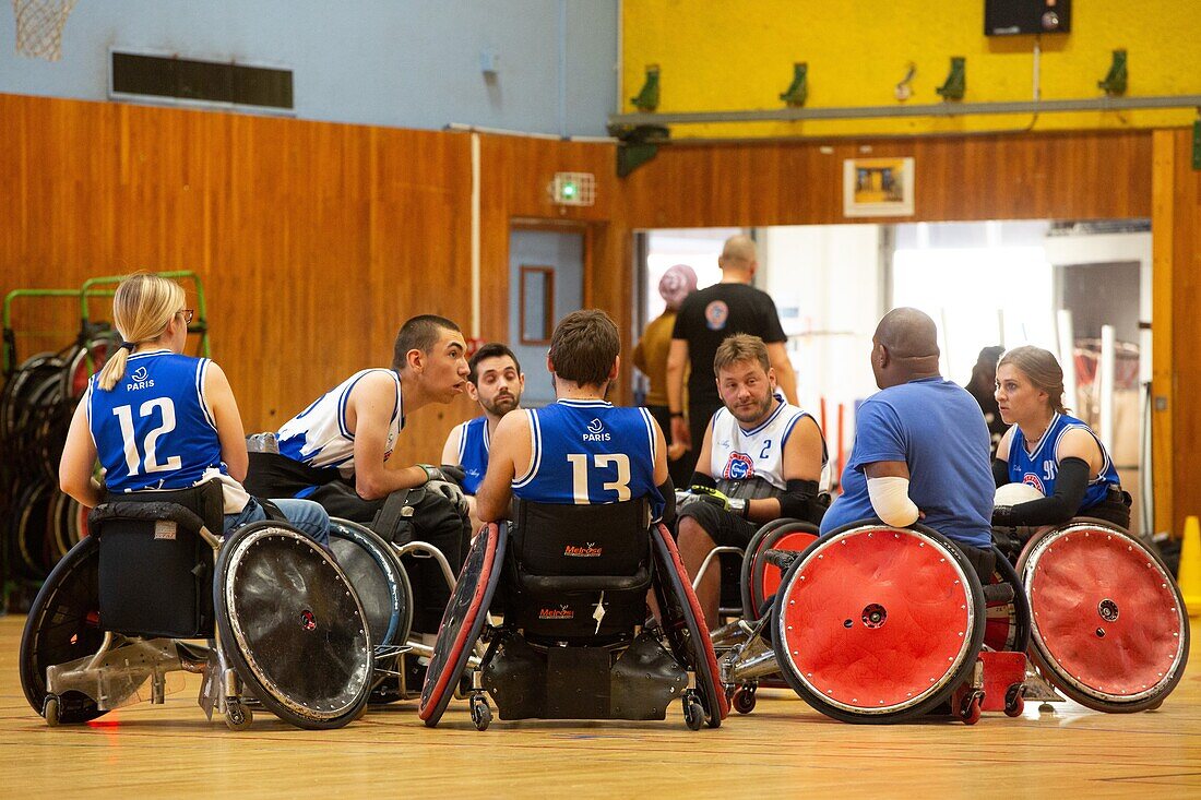 Briefing before handi rugby training, team sports for handicapped people in wheelchairs