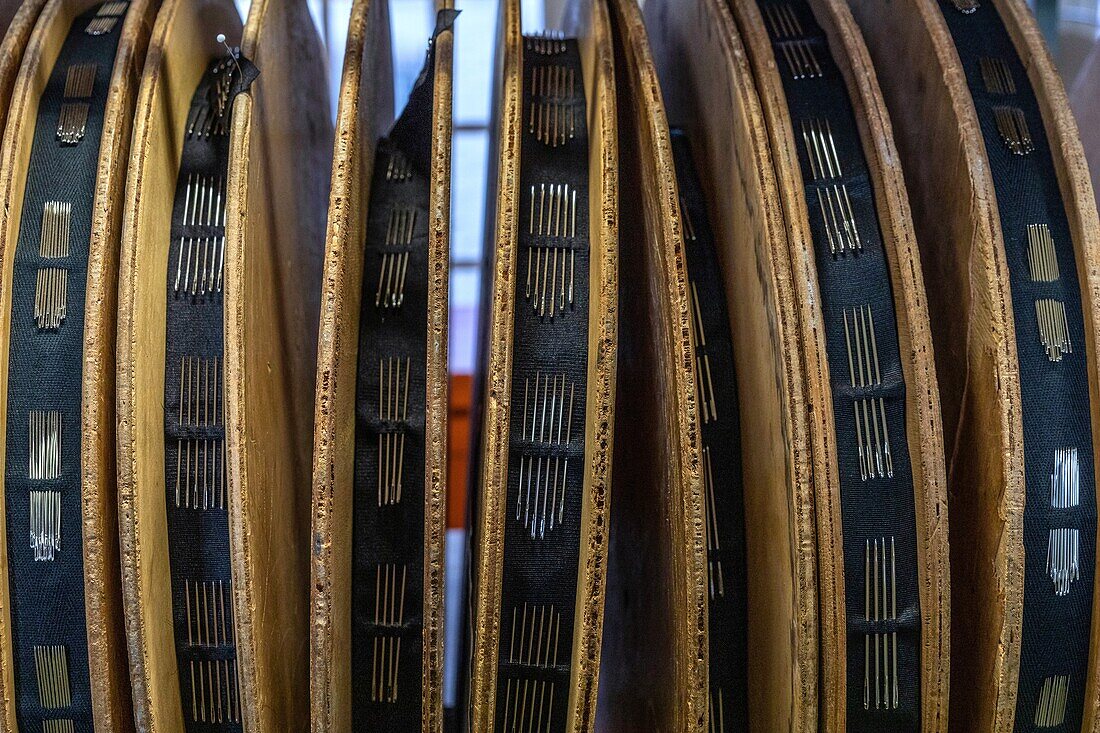 Needles on the bobbins, stitching on the rolls of fabric before packaging, manufacture bohin, saint-sulpice-sur-risle, orne, normandy, france