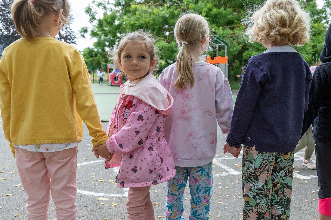 In the playground with friends, integration of children with difficulties in the public schools, roger salengro kindergarten, louviers, eure, normandy, france