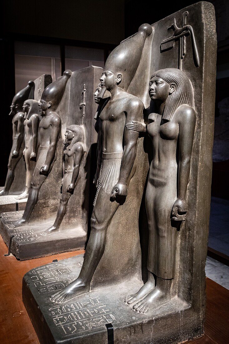 Statuary from the old empire, the triad of pharaoh mykerinos flanked by the goddess hathor and the nome of cynopolis, schist statue, egyptian museum of cairo devoted to egyptian antiquity, cairo, egypt, africa