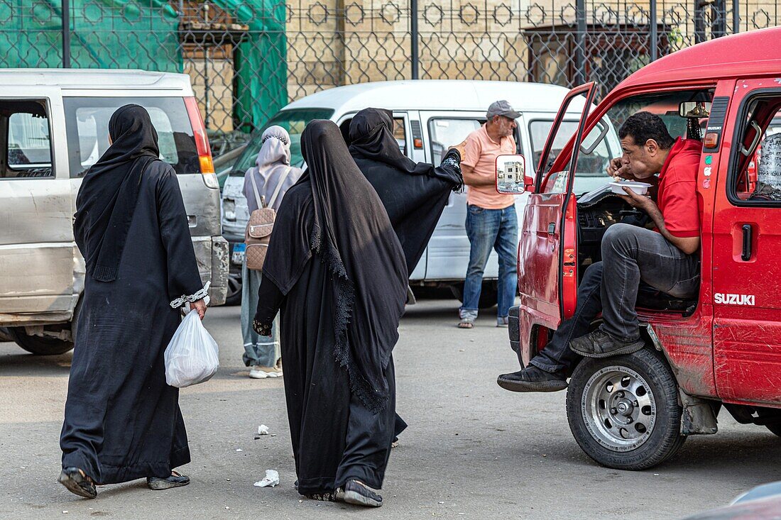 Street scene with veiled women, khan el-khalili souk, cairo, egypt, africa