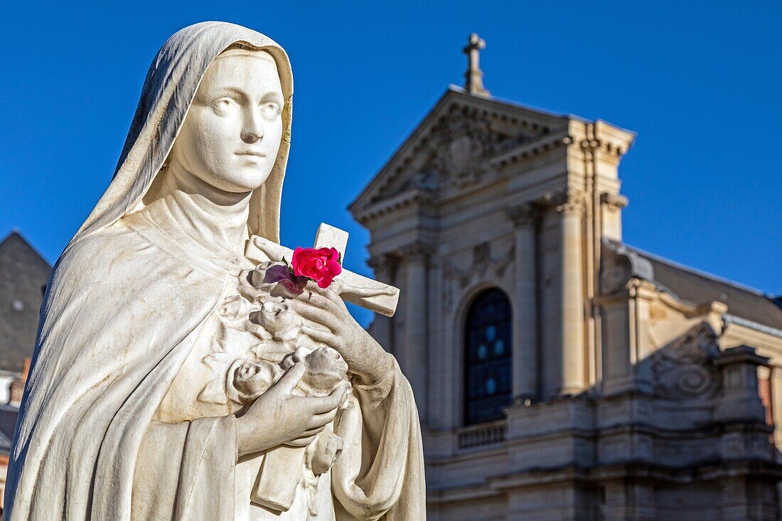 Statue of sainte-therese of the infant jesus with a rose in front of the carmelite convent, lisieux, pays d'auge, normandy, france