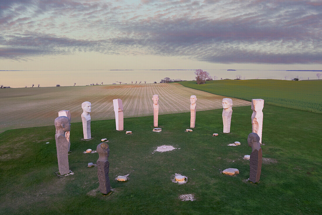 Aerial view of the site of the stone statues of Dodekalitten with clouds at sunset, Lolland island, Zealand, Denmark, Europe