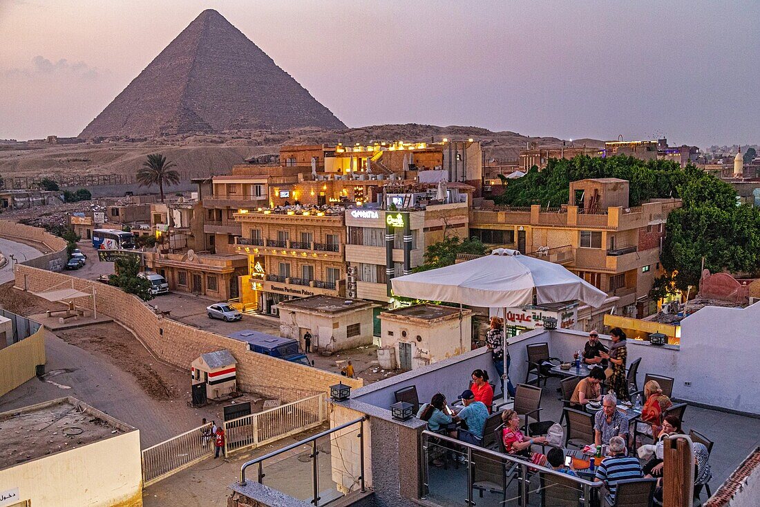Outdoor cafe at the foot of the pyramids of giza, cairo, egypt, africa