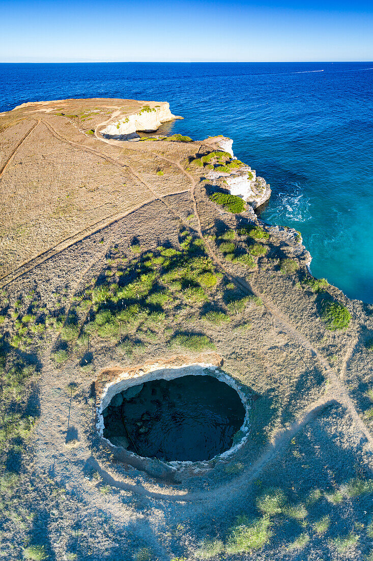 Open cave overlooking the turquoise sea from above, Otranto, Lecce province, Salento, Apulia, Italy