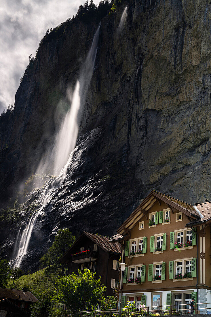 Waterfall on mountain ridge, Lauterbrunnen, Bernese Oberland, canton of Bern, Switzerland