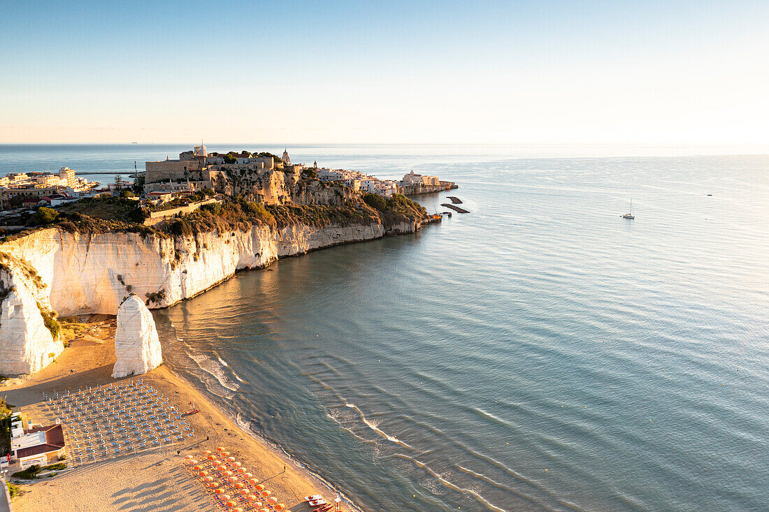 Aerial view of Pizzomunno white rock monolith along the Vieste sand beach, Foggia province, Gargano National Park, Apulia, Italy