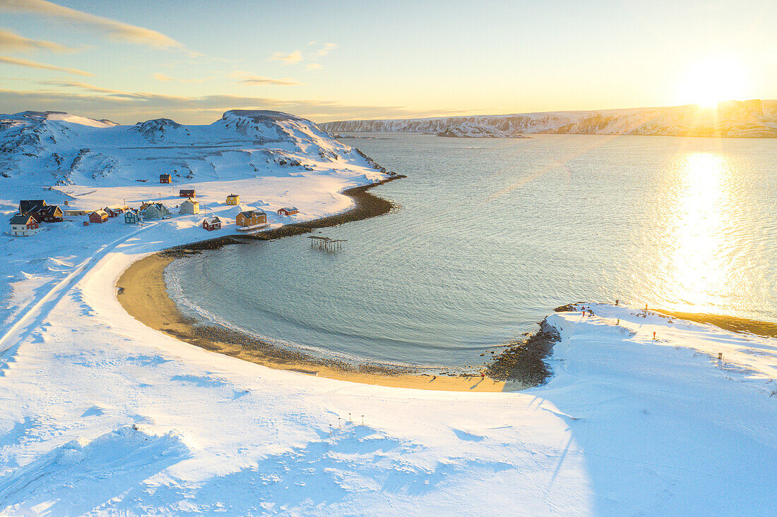 Sand beach in the snowy landscape lit by sunrise, aerial view, Veines, Kongsfjord, Varanger Peninsula, Finnmark, Norway