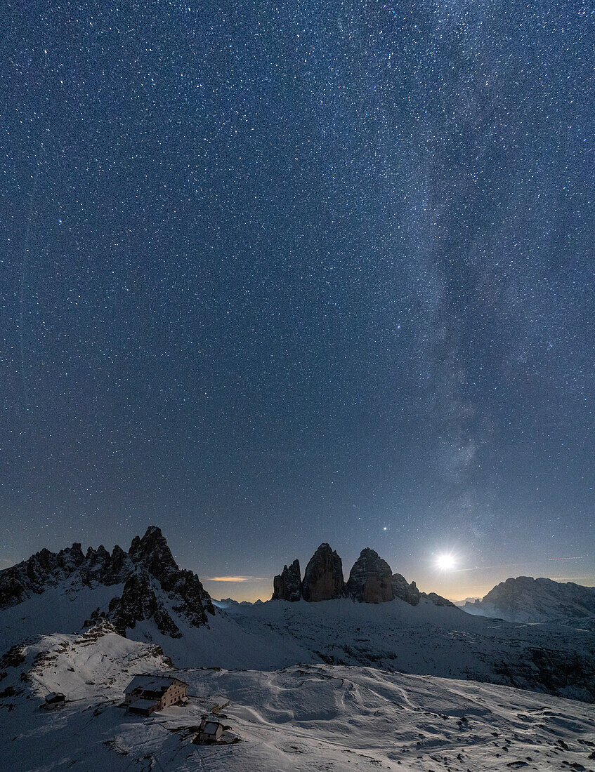 Moonlight on snowy Monte Paterno, Tre Cime di Lavaredo and Rifugio Locatelli, Sesto Dolomites, South Tyrol, Italy