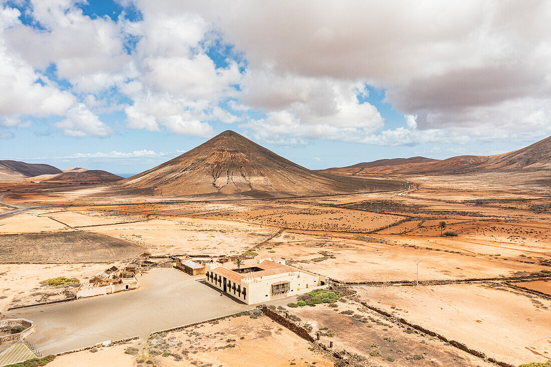 Volcano in the barren land close to Casa de los Coroneles (House of Colonels), La Oliva, Fuerteventura, Canary Islands, Spain