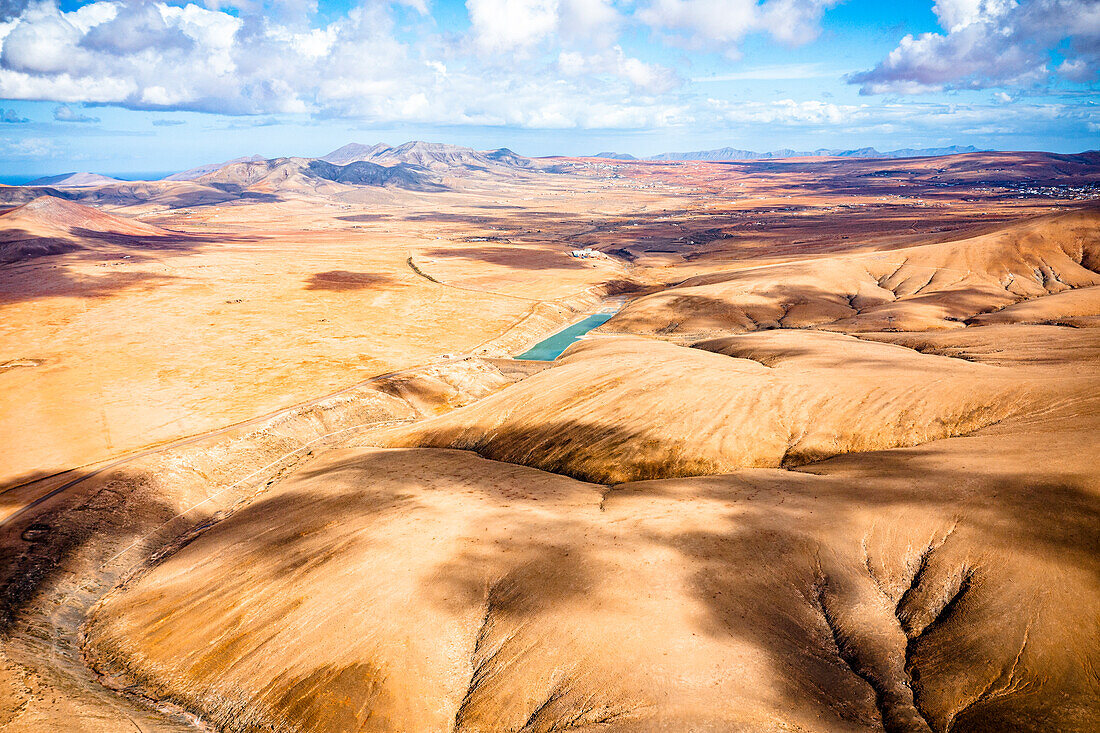 Aerial view of river among desert canyons and ravine of Barranco de los Molinos, Tefia, Fuerteventura, Canary Islands, Spain