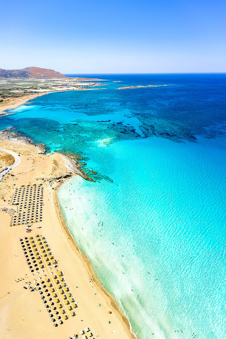 Aerial view of the equipped beach of Falassarna washed by the turquoise sea, Kissamos, Chania, Crete island, Greece