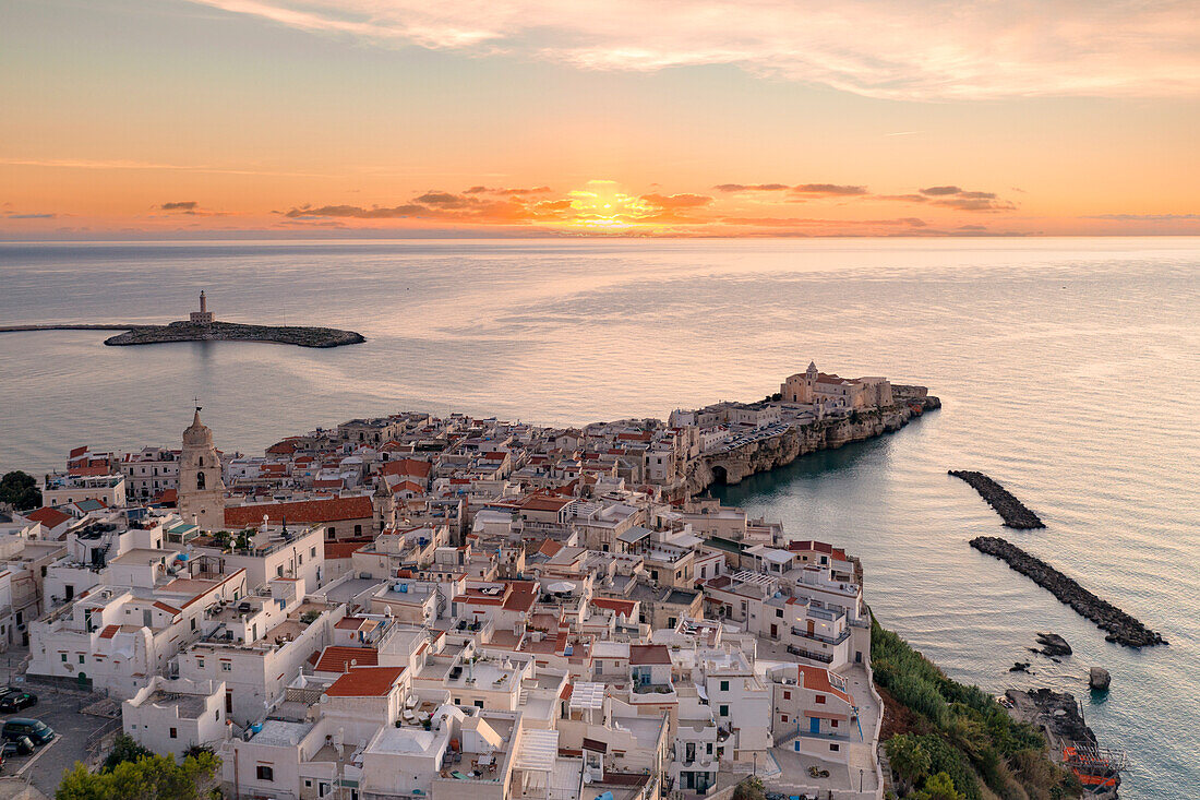 White buildings by the sea at dawn, aerial view, Vieste, Foggia province, Gargano National Park, Apulia, Italy