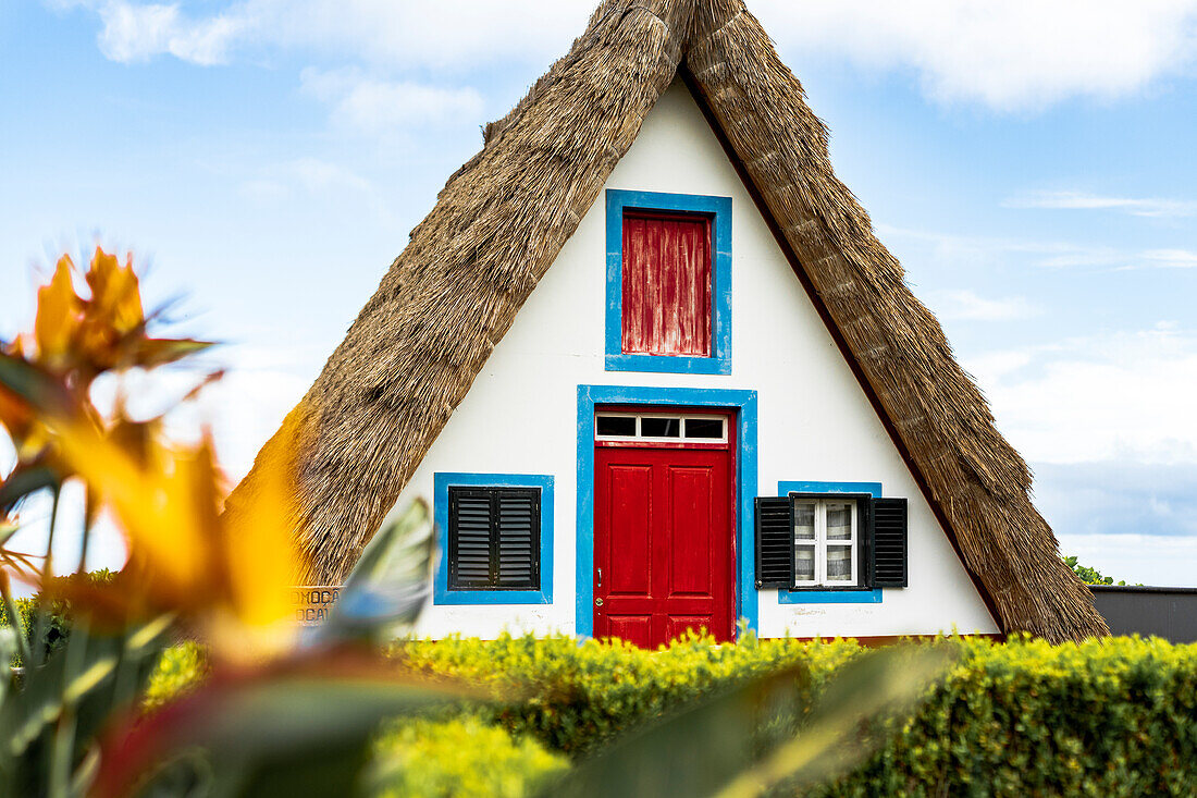 Facade of traditional thatched triangular houses in Santana, Madeira island, Portugal