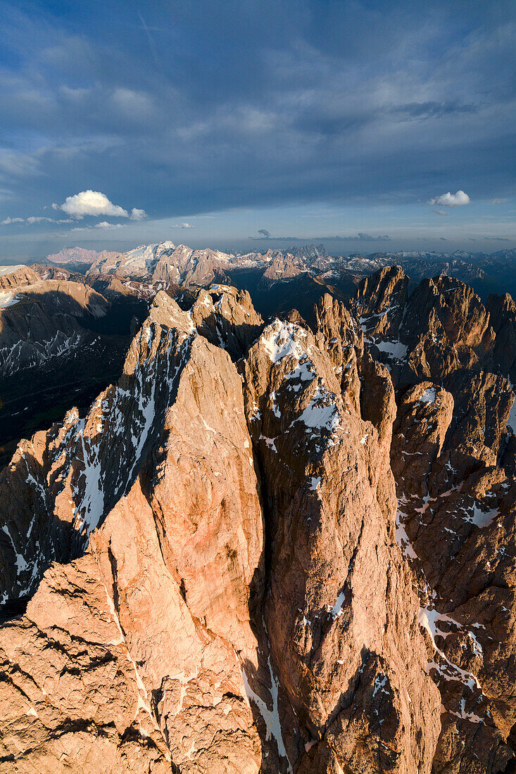 Aerial view of Sassolungo group and Marmolada at sunset, Dolomites, South Tyrol, Italy