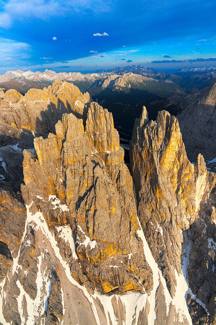 Rock pinnacles of Torri Del Vajolet at sunset, aerial view, Dolomites, South Tyrol, Italy