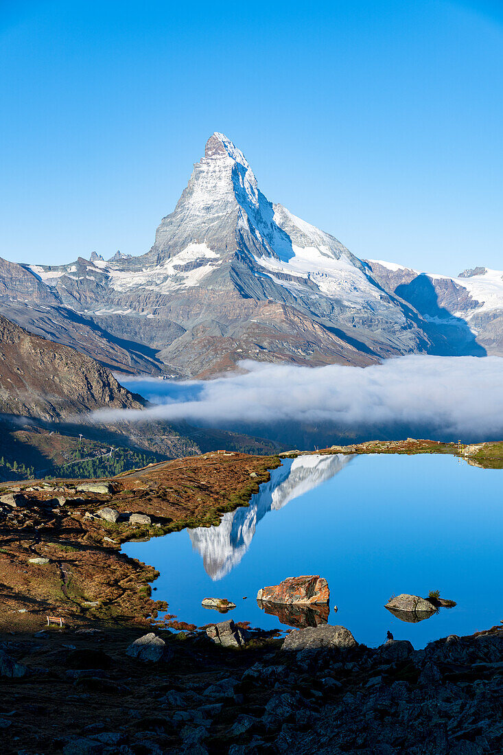 Matterhorn reflected in lake Stellisee at dawn, Zermatt, Valais canton, Switzerland