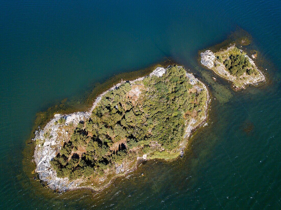 Aerial view of small island in front Mossala Island Resort Southwest Finland archipielago. The archipelago ring road or Saariston rengastie is full of things to see, do and do. The Archipelago Trail can be taken clockwise or counter clockwise, starting in the historical city of Turku, and continuing through rural archipelago villages and astonishing Baltic Sea sceneries. The Trail can be taken from the beginning of June until the end of August.